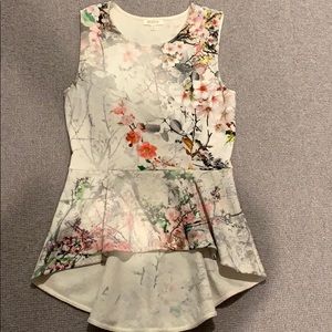 Peplum sleeveless top
